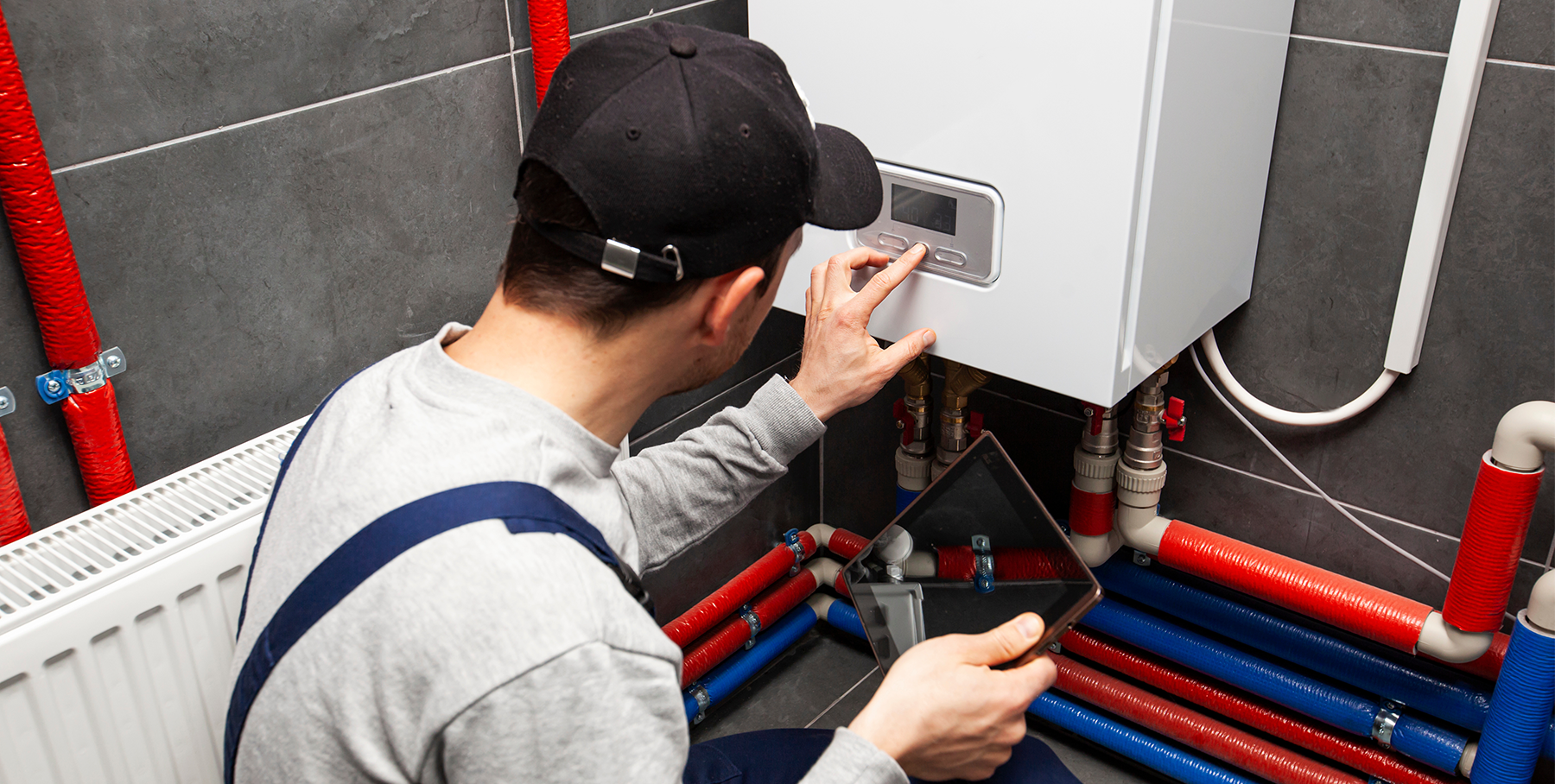 Technician installing heating system