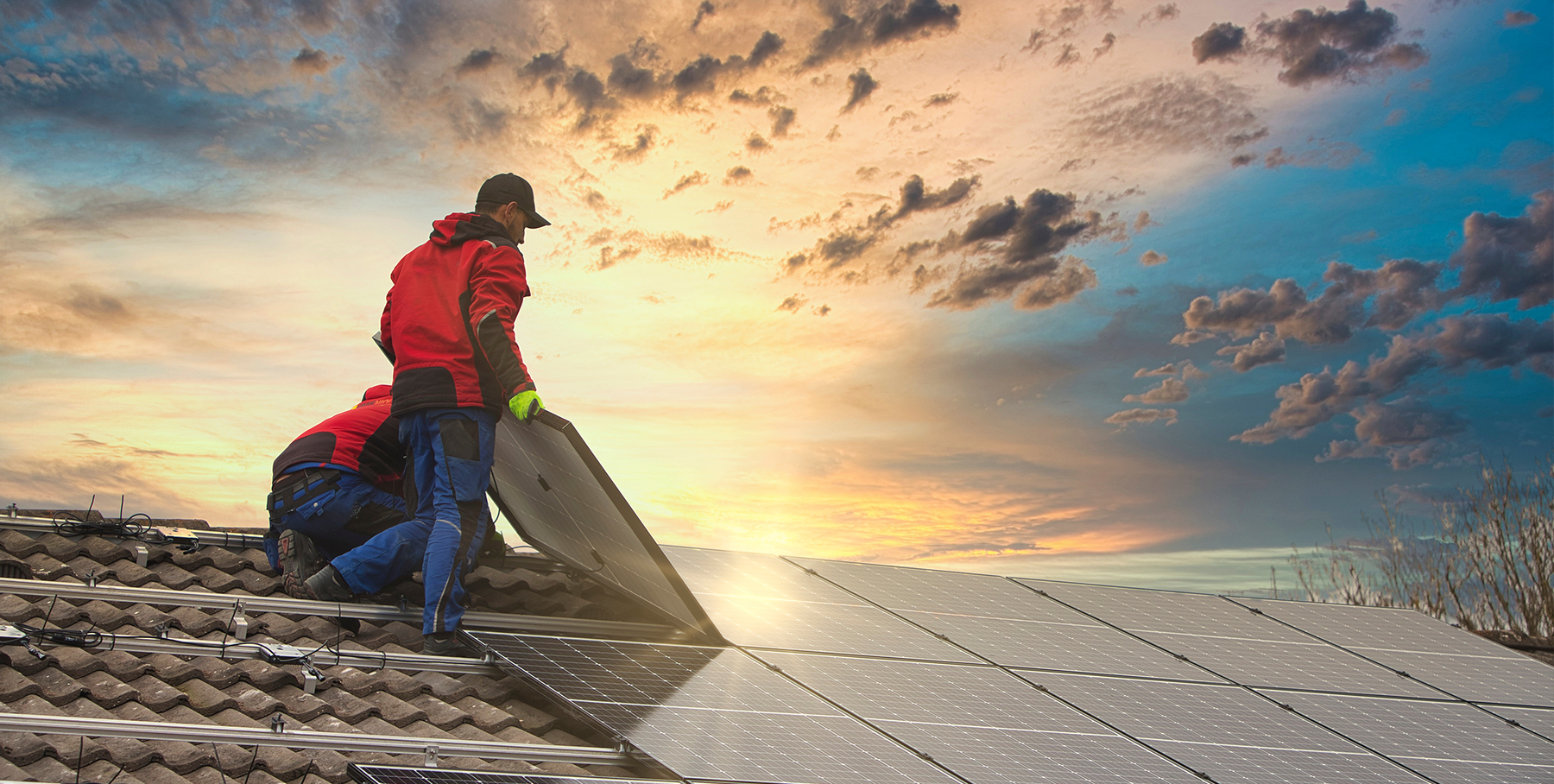 Worker installing solar panels